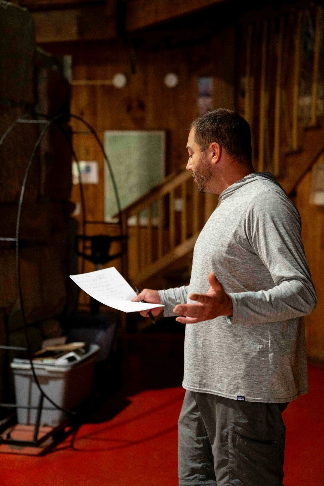 Studio founder reviewing a script before an interview