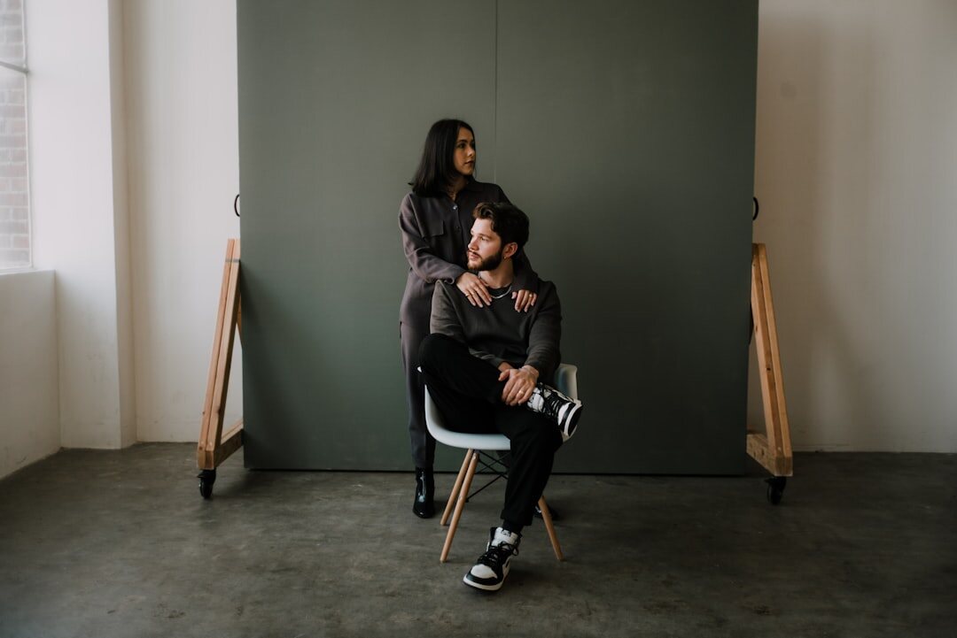 Two people having a filmed conversation in a studio